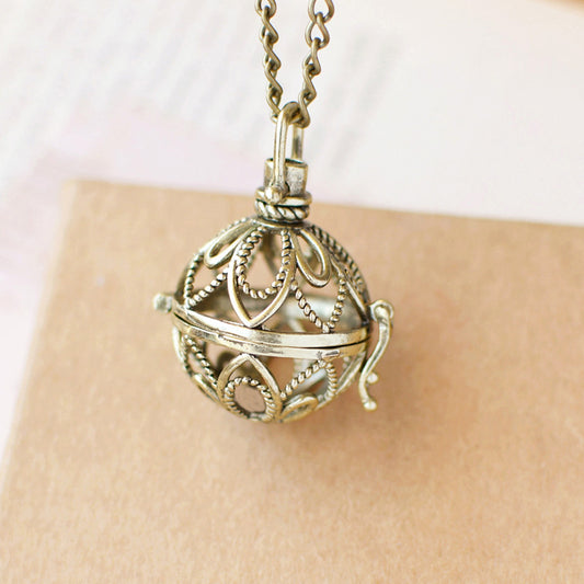 Retro Artistic Hollowed-out Sachet Ball Pendant Necklace