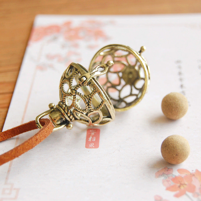 Retro Artistic Hollowed-out Sachet Ball Pendant Necklace